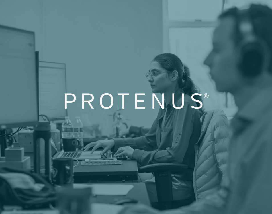 A blue overlay with the organization and RadarFirst partner, Protenus, hovers over a team of information technology professionals who are hard at work at their desktop computers. | RadarFirst