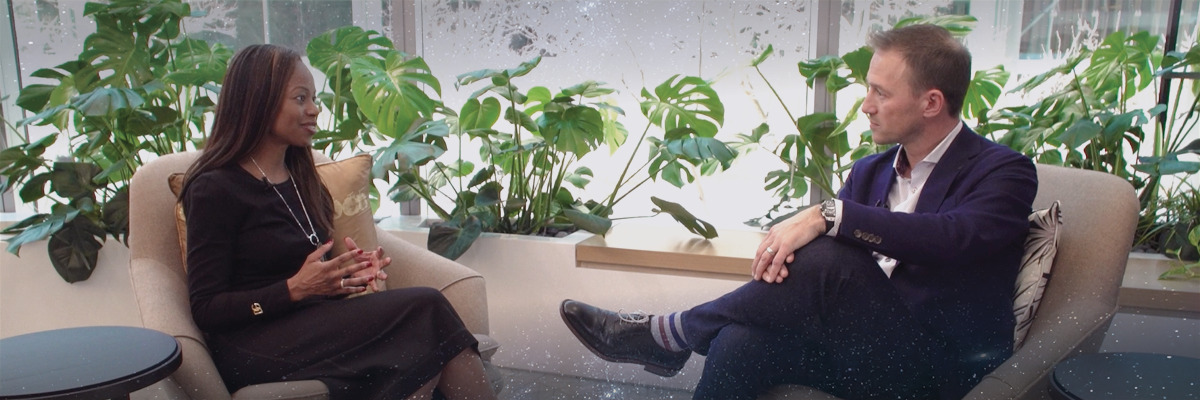 Dominique and Don are seated in armchairs discussing why privacy should be a Board-level interest.